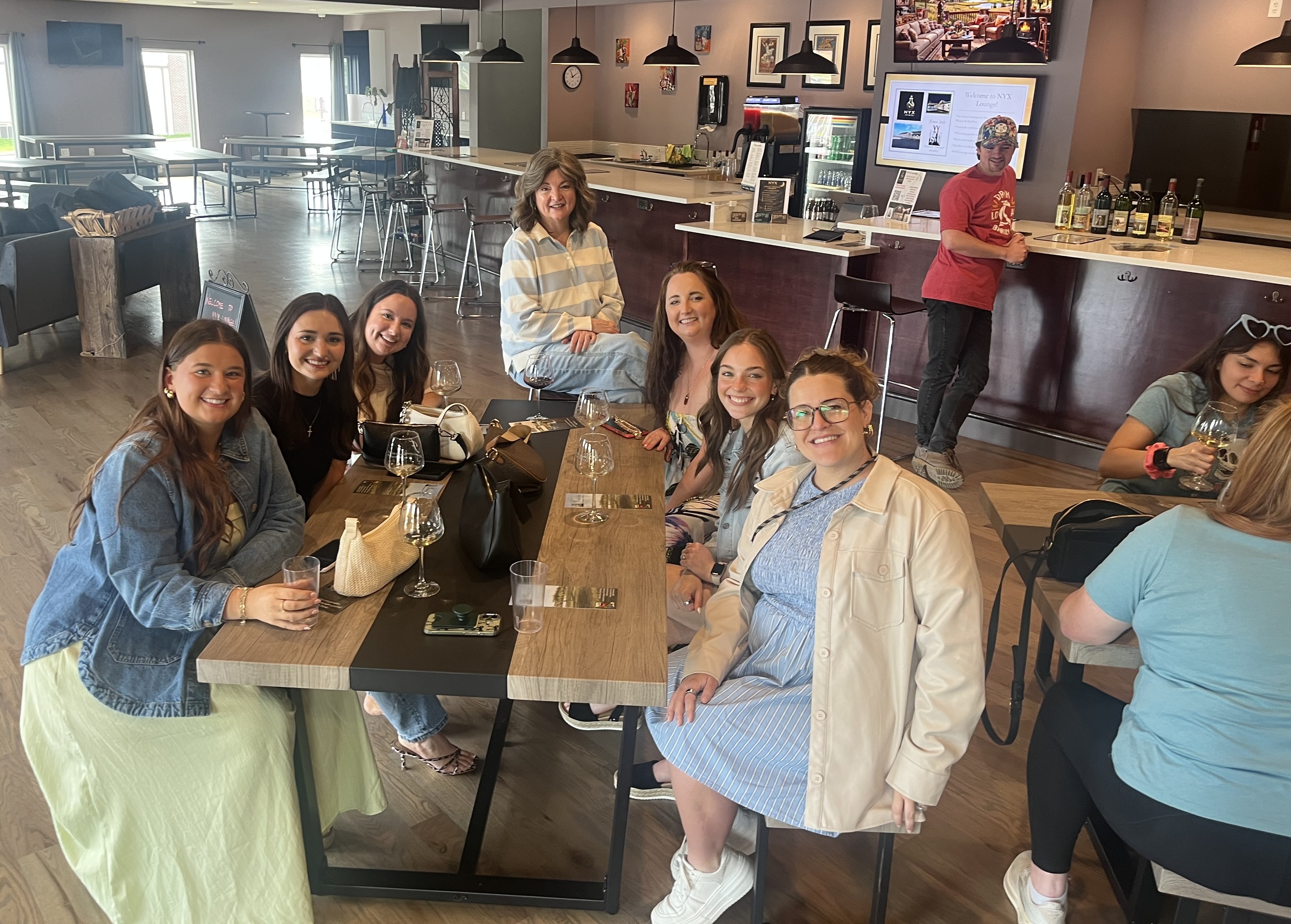 Guests enjoying drinks at NYX Spirits & Lounge in Gladstone