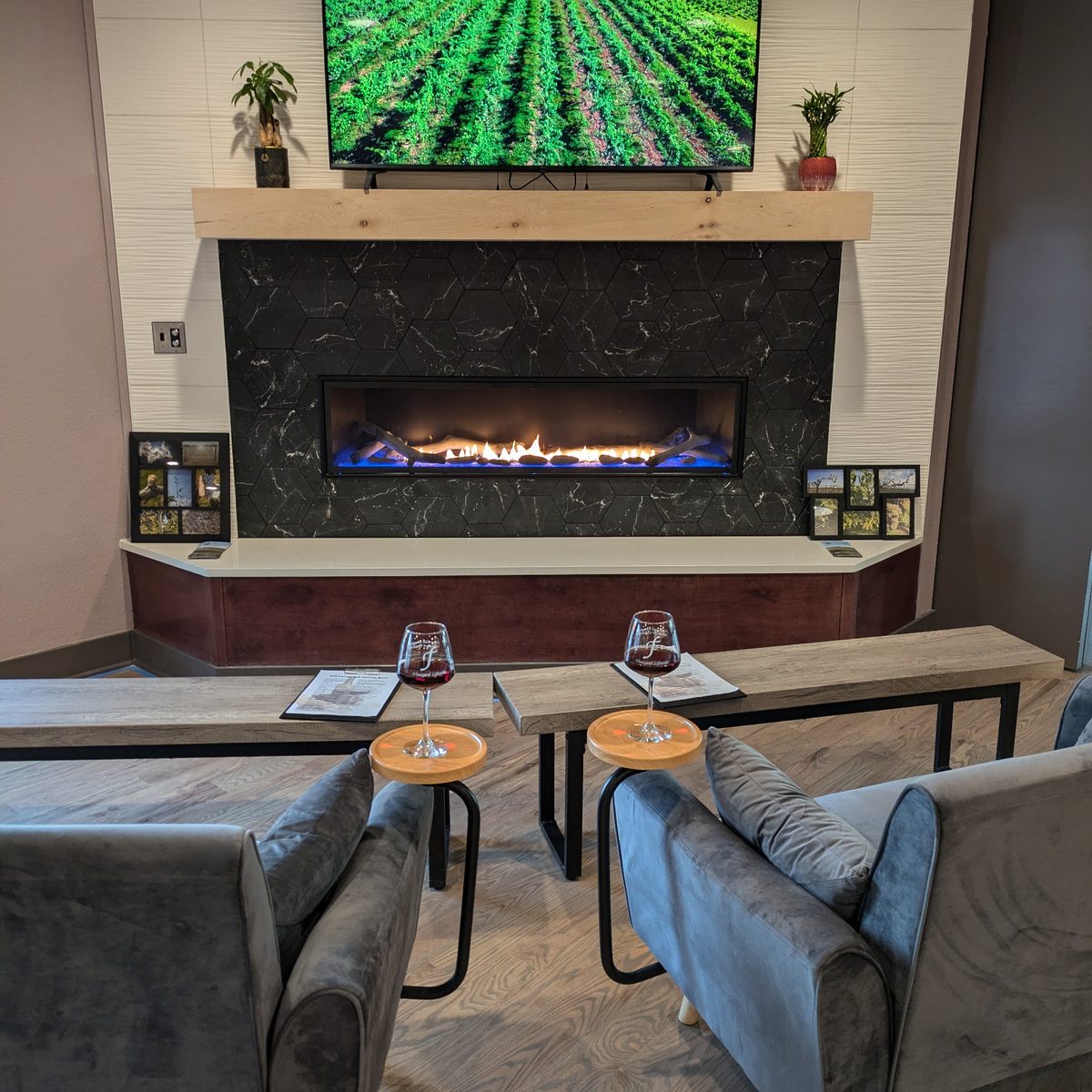 Lounge seating near the fireplace at NYX Spirits & Lounge in Gladstone, Missouri.