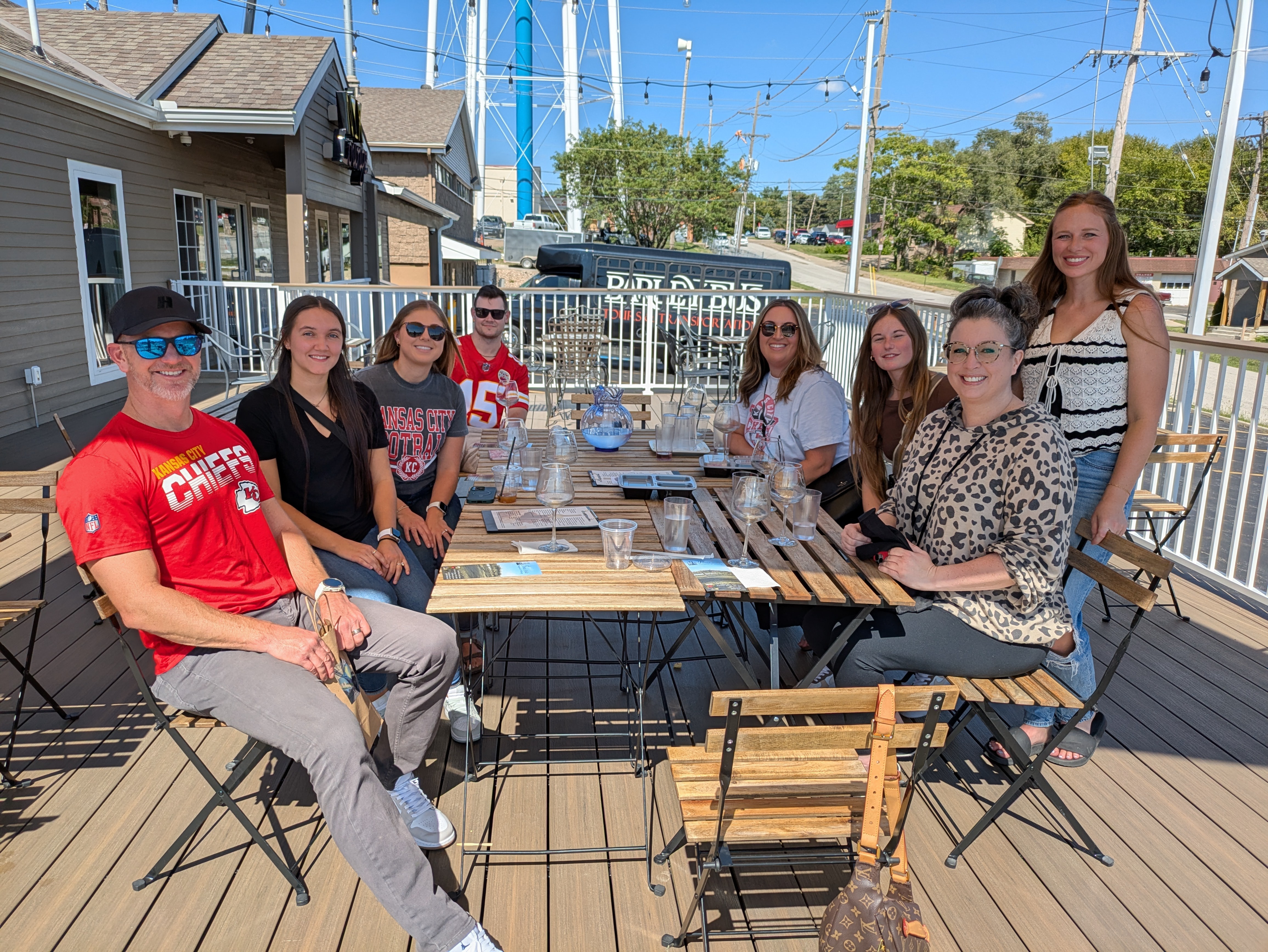 Guests enjoying drinks on the NYX Spirits & Lounge patio deck