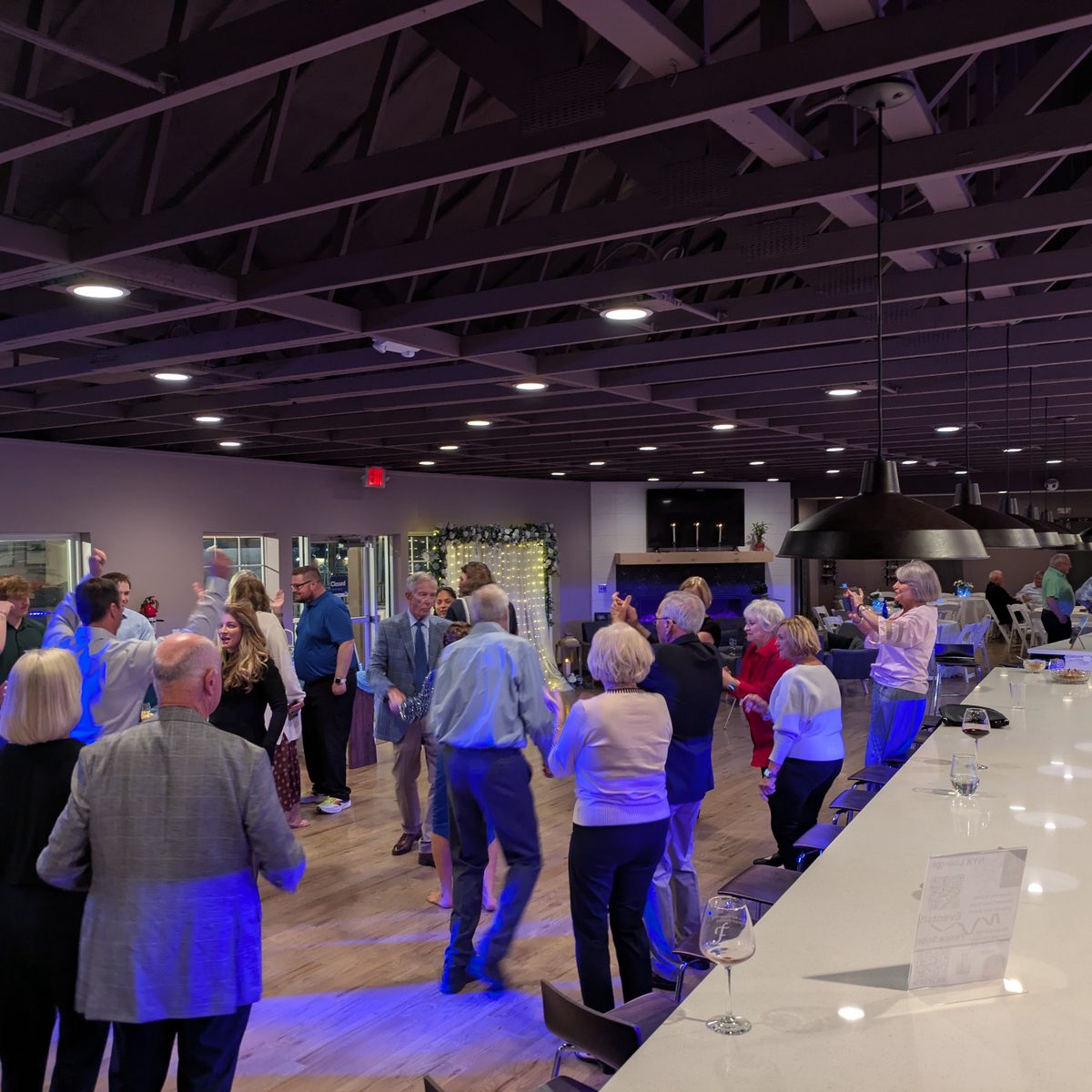 Guests dancing during a private event at NYX Spirits & Lounge.