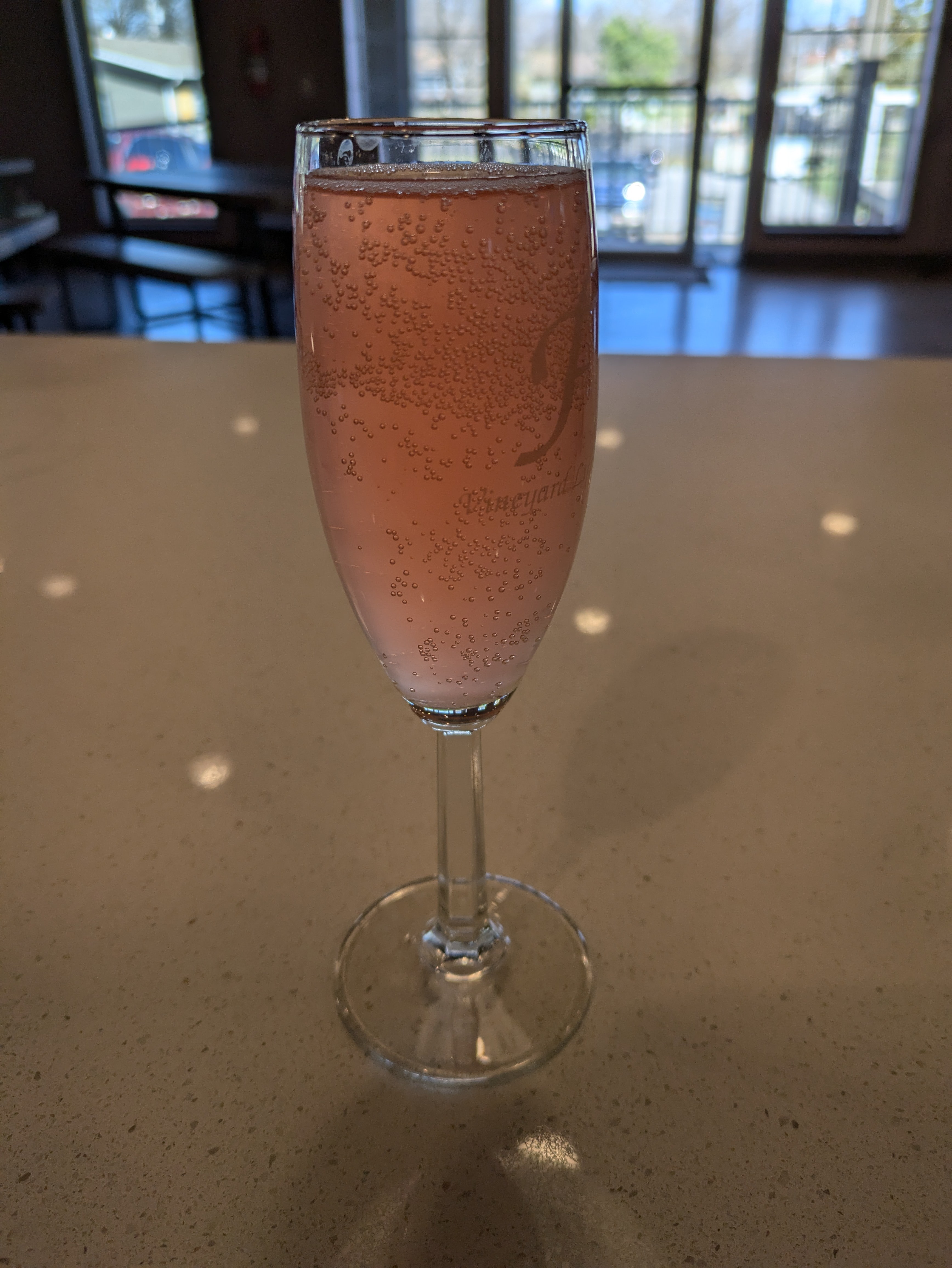 A strawberry mimosa cocktail at NYX Spirits and Lounge — part of the craft cocktail menu in Gladstone Missouri