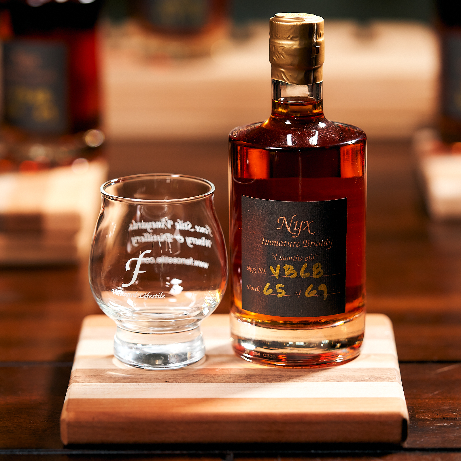 NYX Spirits branded brandy bottle on display at NYX Spirits and Lounge in Gladstone Missouri