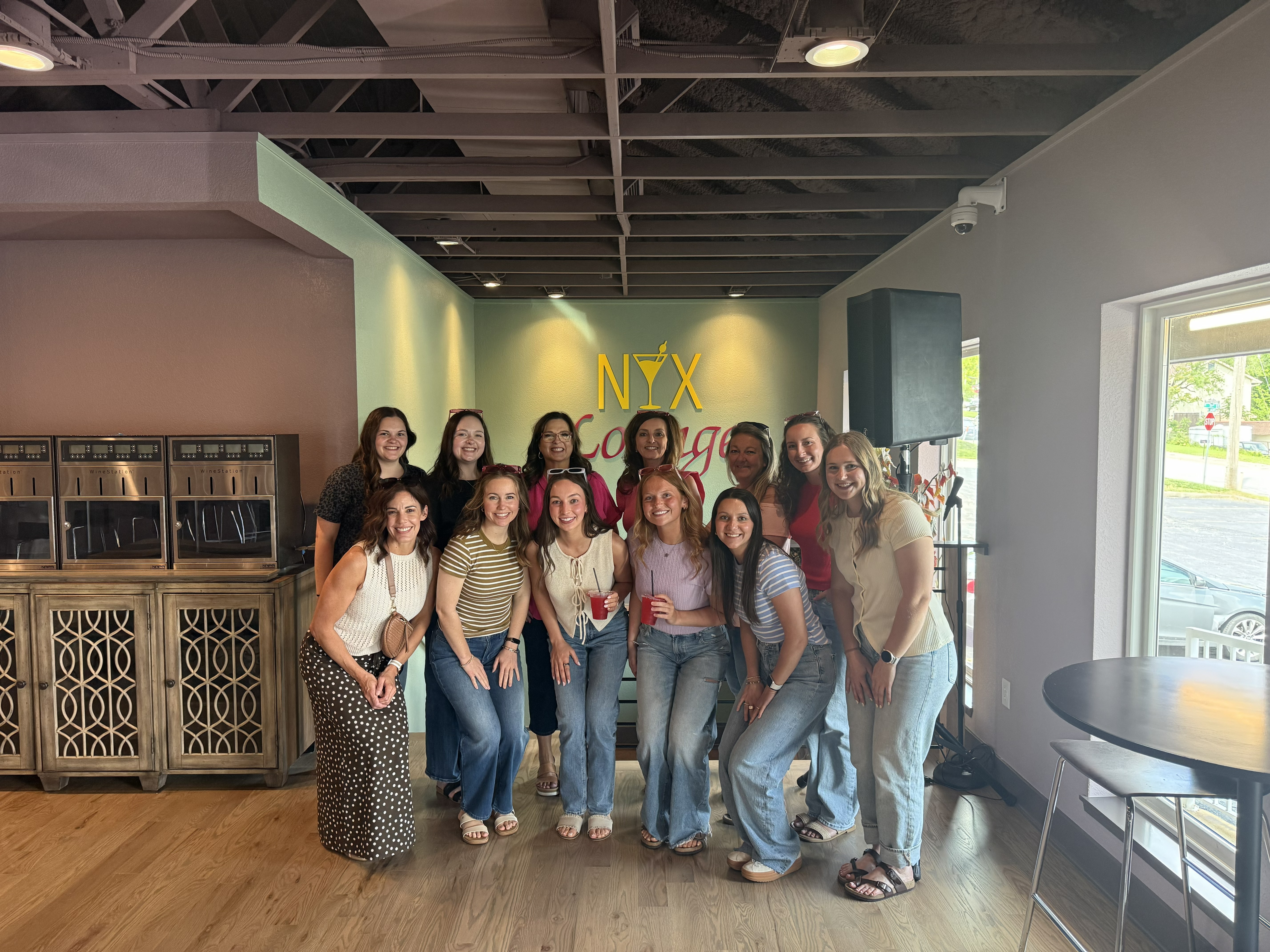 A group of friends gathered at NYX Spirits and Lounge in Gladstone, enjoying a night out together